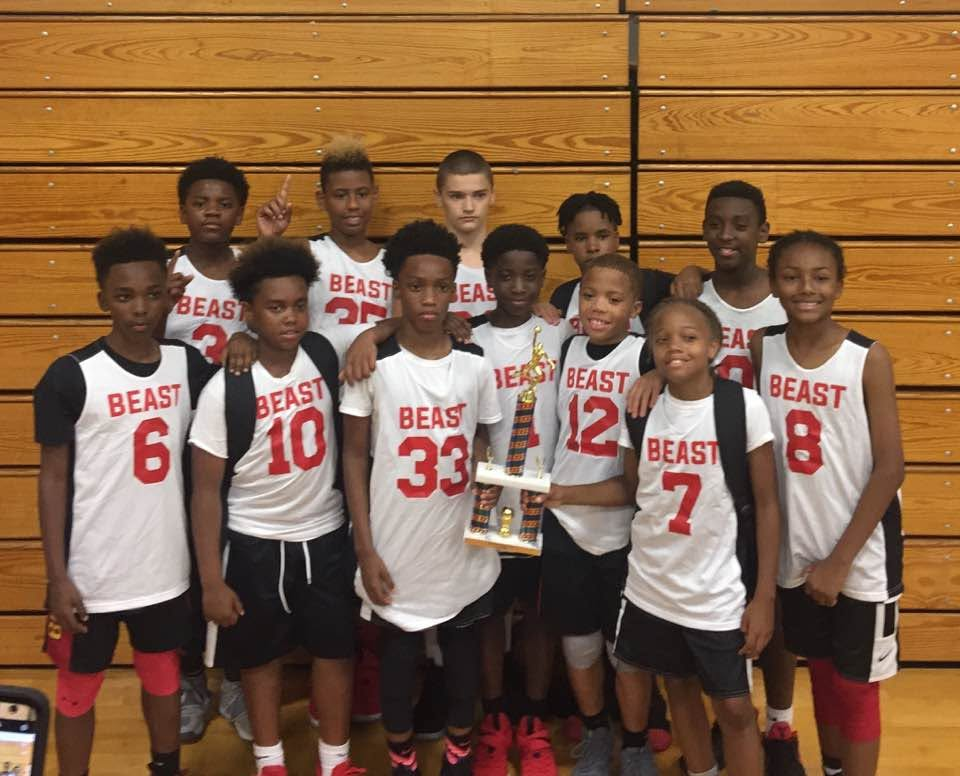Youth basketball team celebrating together